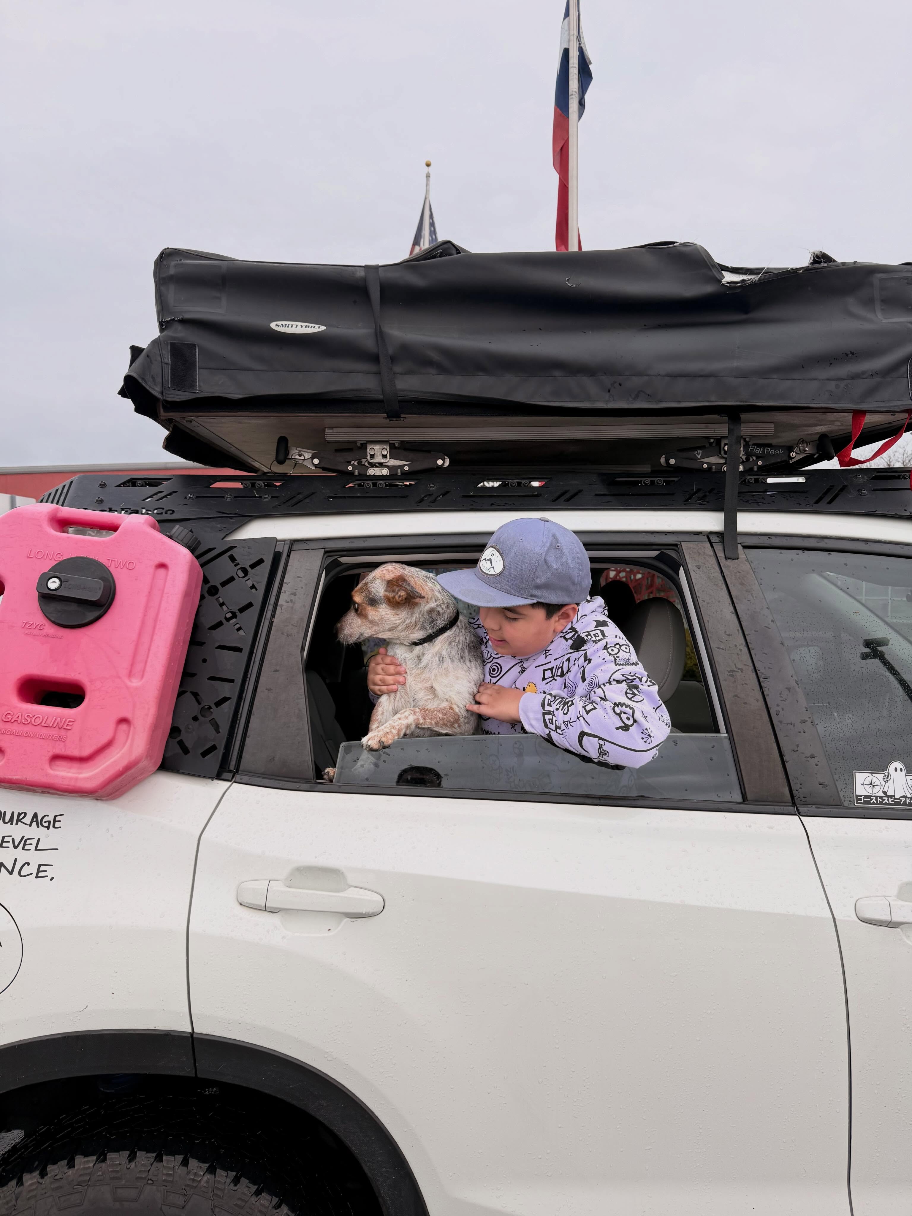 Jonah and Boo riding shotgun in the Ghost — this is who we built it for