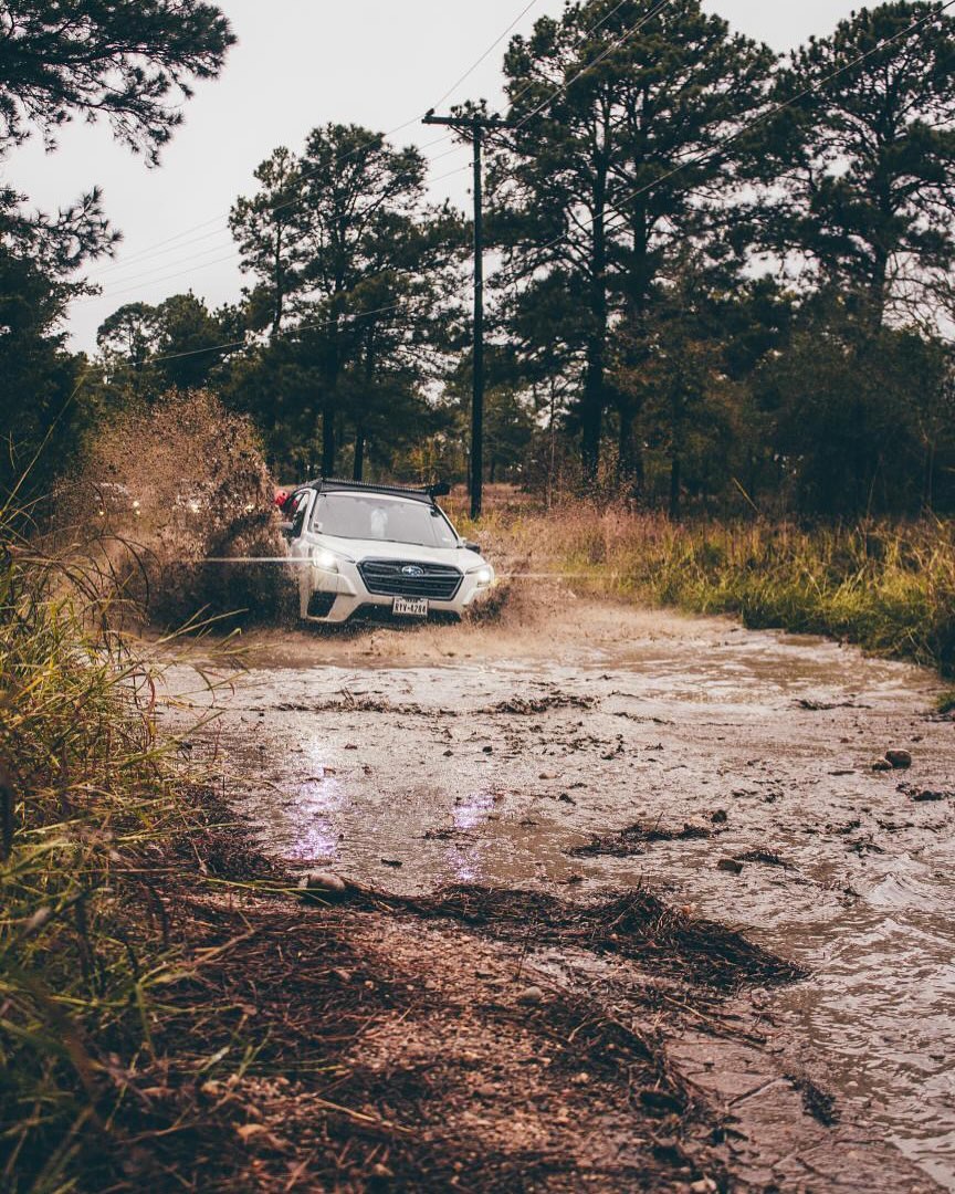 The Ghost charging through the mud — symmetrical all-wheel drive doing exactly what it was built for