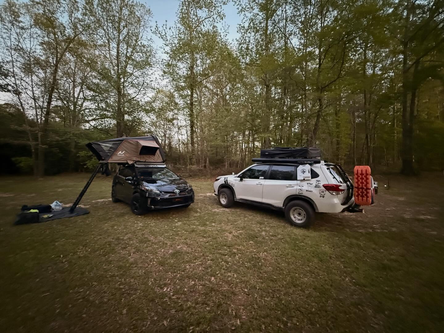Rooftop tent up, camp set — the extras only ride along if they earn the space